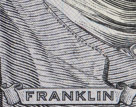 Look very carefully at Franklin's shirt collar on the $100 bill. There it is written 'THE UNITED STATES OF AMERICA'.