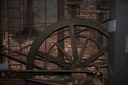 Fly wheel of the machine shop steam engine. It generated about 100 hp using the method of calculation of the era. About 400 hp today. This engine has not run in some time even though it is all cleaned up for public display.