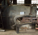 Hole punch. Again used to punch holes into hot steel sheet up to about an inch thick.  Same scale as the shear.