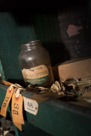 In one of the shelves for employees personal stuff this set of tags and the AppleButter jar. Probably used to store small parts.