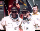 Astronauts Conrad and Gordon back aboard the carrier after the Gemini XI mission.  Gemini record altitude with apogee of 739.2 nautical miles (1,369.0 km) reached using Agena propulsion system after first orbit rendezvous and docking. Gordon made 33-minute EVA and two-hour standup EVA. 44 orbits.