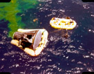 Recovery of astronauts and capsule. Slide does not identify mission.  The green in the water is not antifreeze. It is an green dye  to help airplanes  find the astronauts if they do not land close to the carrier.