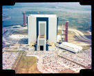 Vertical Assembly Building(VAB) with Saturn V 500F being rolled out.  The lower building in front of the rocket is where the launch control computers were located and where I worked most of the time. My office wass in the front lower section of the vertical assembly building.  A coffee shop at the end of the walkway linking the two buildings is where I really learned to drink coffee. We worked around the clock frequently in those days.