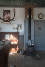 The hotel lobby. That is a coal stove.