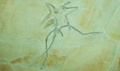 Archaeopteryx lived in the Late Jurassic around 150 million years ago, in what is now southern Germany during a time when Europe was an archipelago of islands in a shallow warm tropical sea, much closer to the equator than it is now. Similar in size to a Eurasian magpie, with the largest individuals possibly attaining the size of a raven, the largest species of Archaeopteryx could grow to about 0.5 m (1 ft 8 in) in length. Despite their small size, broad wings, and inferred ability to fly or glide, Archaeopteryx had more in common with other small Mesozoic dinosaurs than with modern birds. In particular, they shared the following features with the dromaeosaurids and troodontids: jaws with sharp teeth, three fingers with claws, a long bony tail, hyperextensible second toes (