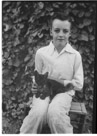 Age 12 years, 3 months
August 19, 1954.
Cat is Bobby. Note the bobbed tail. It was actually a birth defect. His tail was just all wadded up rather than straight and flexible. Very friendly. Note that he is kneeding his claws on my leg. At this time we are living at the Walston Place.