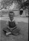 Aged 5 years, 11 months.
April 19, 1948
In fornt yard of the Johnson Place. Garage is in the background. The tree in the upper right corner of the picture is still there. The house, garage, barn and pens are gone. I think the tree on the left is still there also.