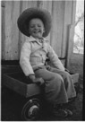 Aged 5 years, 8 months, 2 days.
January 21, 1948.  At Johnson place. The wagon figured prominately in my activities at that time.