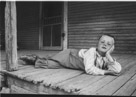 Aged 5 years, 9 months.
February 19, 1948.
On porch of house at Johnson Place. Door is into kitchen.