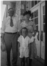 Aged 6 years 2 months, 20 days. 
August 8 1948.
two days after mom's birthday.
In front of elementry school after church.  Yes, women wore gloves and hats to church in those days. Deal with it.