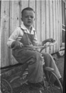 Aged 6 years, 9 months
February 19, 1949.
Would appear to be a picture of me on a tricycle. At Johnson Place.