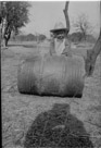 Aged 3 years, 10 months, 1 day.
March 20, 1946.
Me rolling a barrel.  This was one of my favorite toys. I rolled that barrel miles around the house and barns and down to the farm pond and back. And occasionally I would roll it over fresh cow poop. Had to anticipate when that would roll around and avoid it. Also if I rolled the barrel over a cactus after rolling it through the cow poop, the poop would collect the little stickers from the cactus and I would then get the stickers in my hand if not careful.  I tried rolling the barrel over pretty much everything to see what would happen.  Very educational toy. But you won't find it in Fat Brain toys.