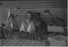 Aged 5 years, 2 months, 21 days.
August 9 1947.
Dog is Suppie. It is interesting to note the toys. The blocks made into a cabin, and car?. The tricyle and toy truck and tractor at the left.