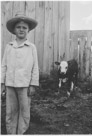 Aged 7 years, 1 month, 3 days.
June 22, 1949.
Do not know the name of the calf. I am the one in  the hat. Calf appears to be nonplussed by situation. 'nonplussed' is rarely used in photo  captions