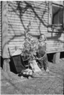 Aged 2 years, 7 months, 14 days.
January 2, 1945.
Third Christmas. Child appears to have made out. A wheelbarrow, wagon. lots of fruit and nuts, coloring books and some kind of thing under the left foot. Note the long hair. Mom did not cut my hair until I was five. That cost me about a dozen therapy sessions.