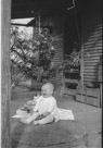 Aged 7 months, 6 days.
December 25, 1942.
First Christmas.
hild appears to down with the whole toy thing. One gift appears to be a Bible.