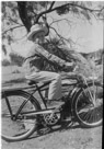 Aged 10 years, 2 months, 3 days.
July 22, 1952.
Rode the bicycle a lot. West Texas is tough on bicycle tires.  This baby was single speed. But it had a light and horn. This is at the Ellis Place. The mesquite tree is still there.