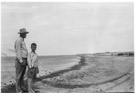 Aged 10 years, 3 months, 1 day.
August 20, 1952.
On Padre Island about 1 mile West of Port Isabel on the Texas Gulf Coast.  
That swoup across the bottom of the picture is an artifact of a crease in the negative.  It even screwed up the original photograph.