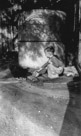 Aged 4 years, 1 month, 2 days.
June 21, 1946.
Feeding a hen. Of interest here is the cistern behind me. This was at the Johnson Place and in the 'L' on the backside of the house they had this cistern to catch the rain runoff.  It was in the shade most of the time so the water was cool even in summer. And the water left your hair soooo soft when washing in it.