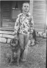 Aged 9 years, 6 months, 15 days.
December 4, 1951.
Just after I got home from school. Dog is Suppie. But notice the cat in the background. What mischief is it up to??
And is it just me or have I seen that shirt before??