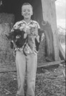 Aged 9 yeard, 4 months, 5 days.
September 24, 1951.
At the Ellis Place. We always had an abundance of cats. These seem to be indifferent to me holding them. The barns were full of mice and we feed them milk. Life was good.