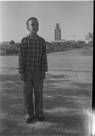 Aged 10 years, 3 months, 14 days.
September 2, 1952.  First day of school in the fifth grade. Picture is taken in Brady. That is the fine Brady grain elevator over my left shoulder.  Note the child's enthusiasm.