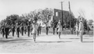 November 11, 1953.
Menard School Band at parade. Closest twirler is Colleen Lagow, next is Carloyn Bradford then Raydell Andrews. Drum Major is Wayne Bradford.