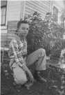 Age 13 years, 5 months, 1 day.
October 20, 1955.
Taken at the back of the house in town. Mom always liked to grow a lot of plants, especially after we moved into town.