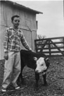 Age 11 years, 10 months, 4 days.
March 23, 1954.
Calf's name is Martha. The calf was one month and 1 day old. It was born on Washington's birthday so we named her Martha. The picture is taken at the Walston Place(owned by Red Williams at the time)