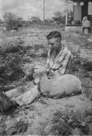 Aged 15 years, 10 days.
May 29, 1957.
With Tillies second set of twin lambs in town. Note the washing machine ourside. And the kerosene can. This is one of my favorite pictures.