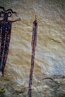 The right tassel has three main thick strands and two thin strands.  There is no 'monkey' or other on this side. The tassel is not symetric with the other in the sense that is can not be made by folding given the odd number of thick  strands. But other wise it is symetric, just using a single thick and single thin strand. Again the great care used in keeping the strands of the tassel separate. And note the two waves in the string at the top.
