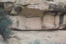 Moving down canyon, this is the first panel is on the east side of the canyon. Note the sawtooth pattern. I call it the closed sawtooth because both a top and bottom are present and the teeth are fully painted. Above this is a sawtooth silhouette. To the right of these is the outline or start of a tapered figure. Is this a practice or dry run??
In any case the closed sawtooth pattern is relative common and appears in both petroglyph and pictograph styles over a wide area in the west.