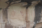 A close up of the tapered figures. The one at the right appears to have the start of a head.