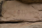And not an overview of this part of the east wall. I am not sure of the authenticity of the figure at the top. Well I think part of it is authentic but maybe not all. Note the two small pale black horned characters at the center  of the main panel.