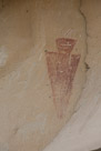 Another view of this fellow. There are more petroglyphs visible in this picture.  Will have to return and get a little more completeness on this panel. I am not sure about the white on his feather(s).  It does appear that he has 2 feathers as well. There also appears to be some sort of crown on this figure. Now I use the word 'crown' in a way that is utterly culture centric to my culture and do not in any claim this is a 'crown' in this sense or was viewed  as such by the artist. It is just a way to convey  to the modern viewer  an attribute of the figure.
