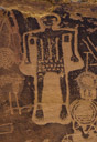 Now we come to this 'negative fully pecked character. No crown is indicated. The body is a rectangle with three interior equally spaced vertical lines. The lower torso , 