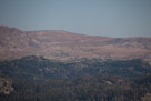 I am still on Clay Butte here shooting a Canon EF100-400mm f/4.5-5.6L IS USM at 400mm. If you look closely in the distance you can see the zig-zags of the road going up to Beartooth Pass.