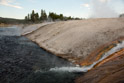 Runoff from the Midway Geyser Basin. Note the algae and the steam.