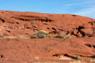 A view along the side of the road at the weathered sandstgone.