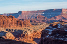 The cliffs on the left are part of the Cutler formation and are on top of the Cedar Mesa formation. All are Permian age.