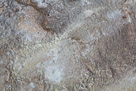 Hot water runnaway from the Silex hot spring. Mineral deposits and bacteria colonies provide color.