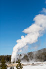 Grand geyser erupting.  Again this geyser erupts for several minutes and releases a great deal of steam. On clear cold winter days like this it is spectacular. This was a long eruption. I probably had time to walk to it.