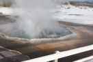One of the hot springs adjacent to Castle geyser. Note that the water is in a rolling boil. At this altitude the boiling point of water is 199 degrees F.  Interestingly the level of the water level in the hot spring does not seem to vary much during the eruption of the large geyser just feet away. Their plumbing appears to be independent.